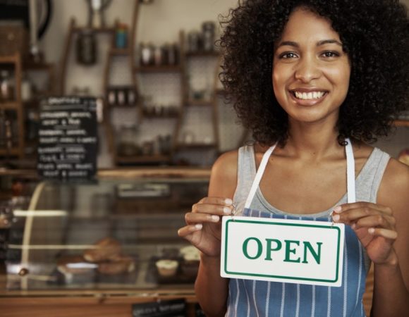 woman-holding-open-sign