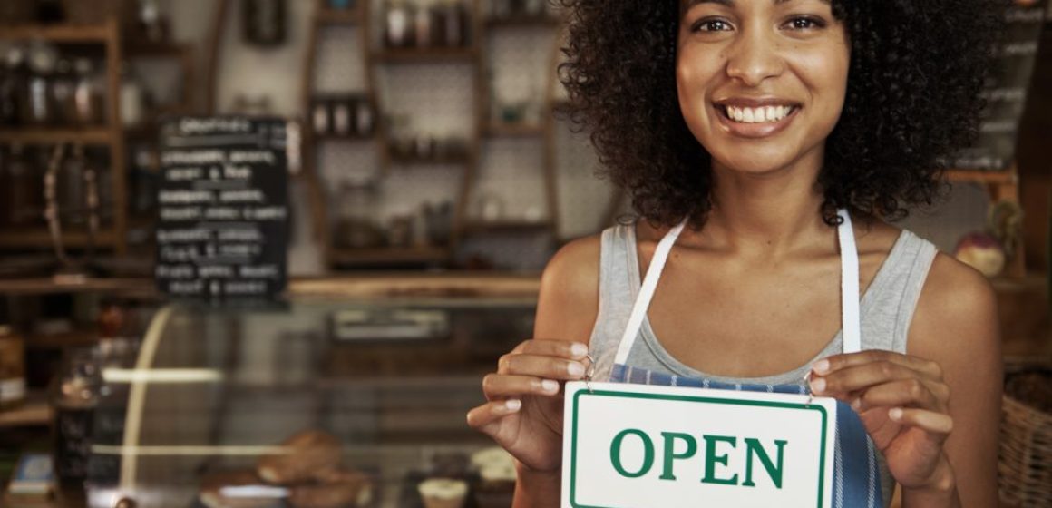 woman-holding-open-sign