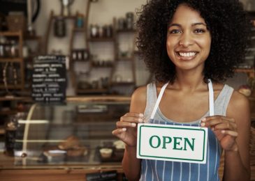 woman-holding-open-sign